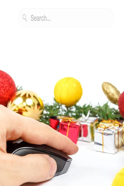 Hand with computer mouse and gifts — Stock Photo, Image