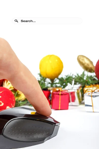 Hand with computer mouse and presents — Stock Photo, Image