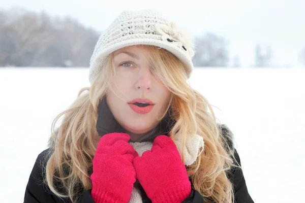 Winter woman in snow photo, looking and blows breath — Stock Photo, Image