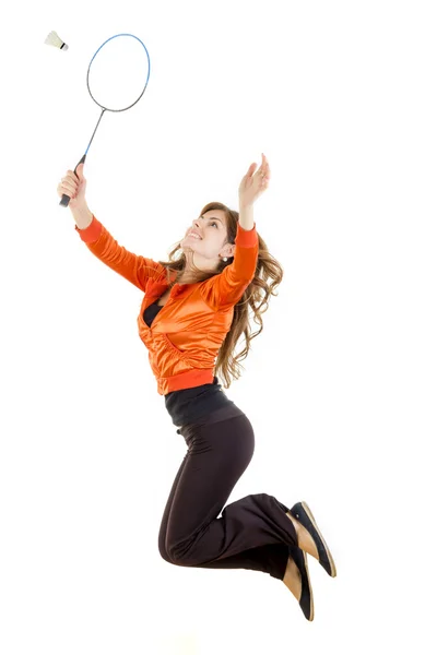 Woman jumping with racket for badminton catching shuttlecock — Stock Photo, Image