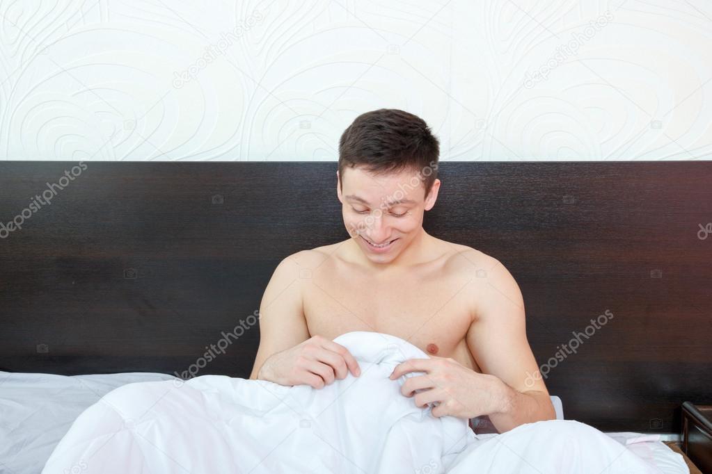 Man feeling a bit shame of his strong erection