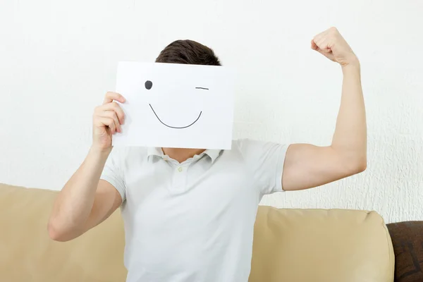 Boy winks and raises fist. Young male advertises successful mode — Stock Photo, Image