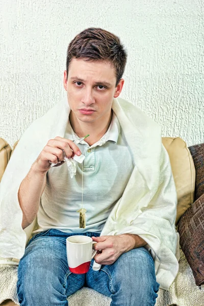 Young adult man treats himself with remedies — 스톡 사진