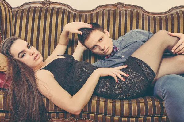 Retro vintage couple lying on the retro furniture — Stok fotoğraf