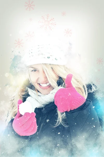 Happy woman in snow holding snow ball in hand for snowballing — Stock Photo, Image