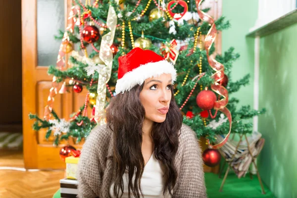 Young woman wondering about Christmas presents and New Year gift — Stock Photo, Image