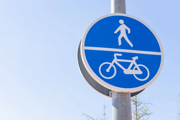 Blue traffic sign for cyclists and pedestrians