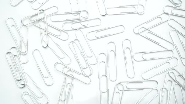 Metal paper clips rotating — Stock Video