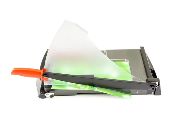 Cutting paper with trimmer on white — Stock Photo, Image