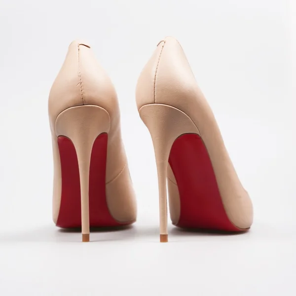 Beige heels over white — Stock Photo, Image