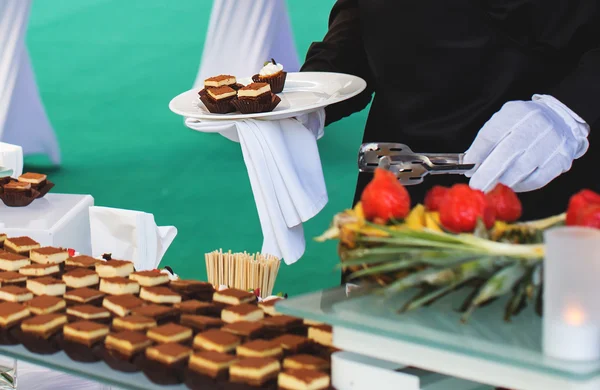 Waiter and buffet — Stock Photo, Image