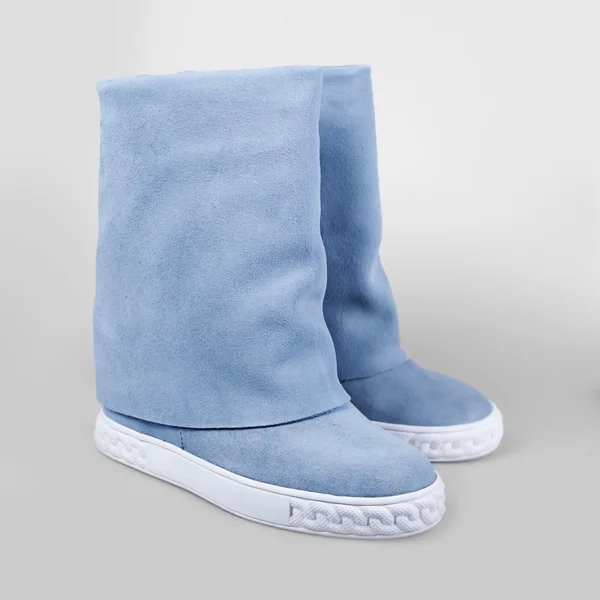 Female blue boots over white — Stock Photo, Image