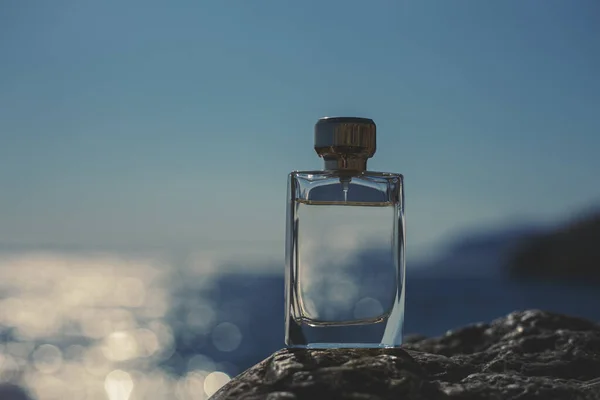 Perfume bottle by the sea