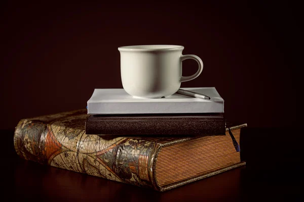 Cup of coffee with book — Stock Photo, Image