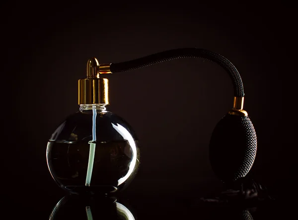Perfume on a black background — Stock Photo, Image