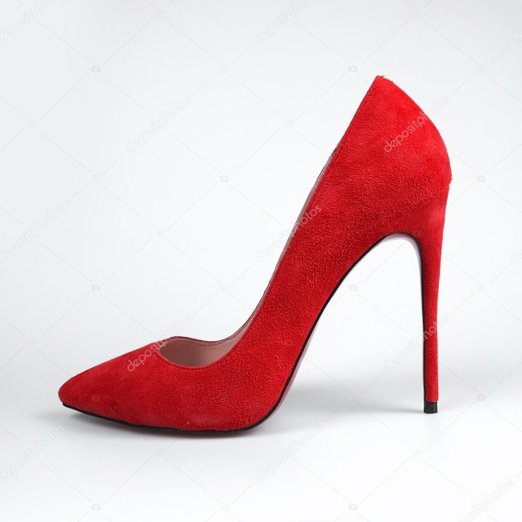 pair of red female shoes on a white background.
