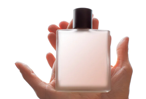 Flacon de parfum à la main isolé sur blanc — Photo