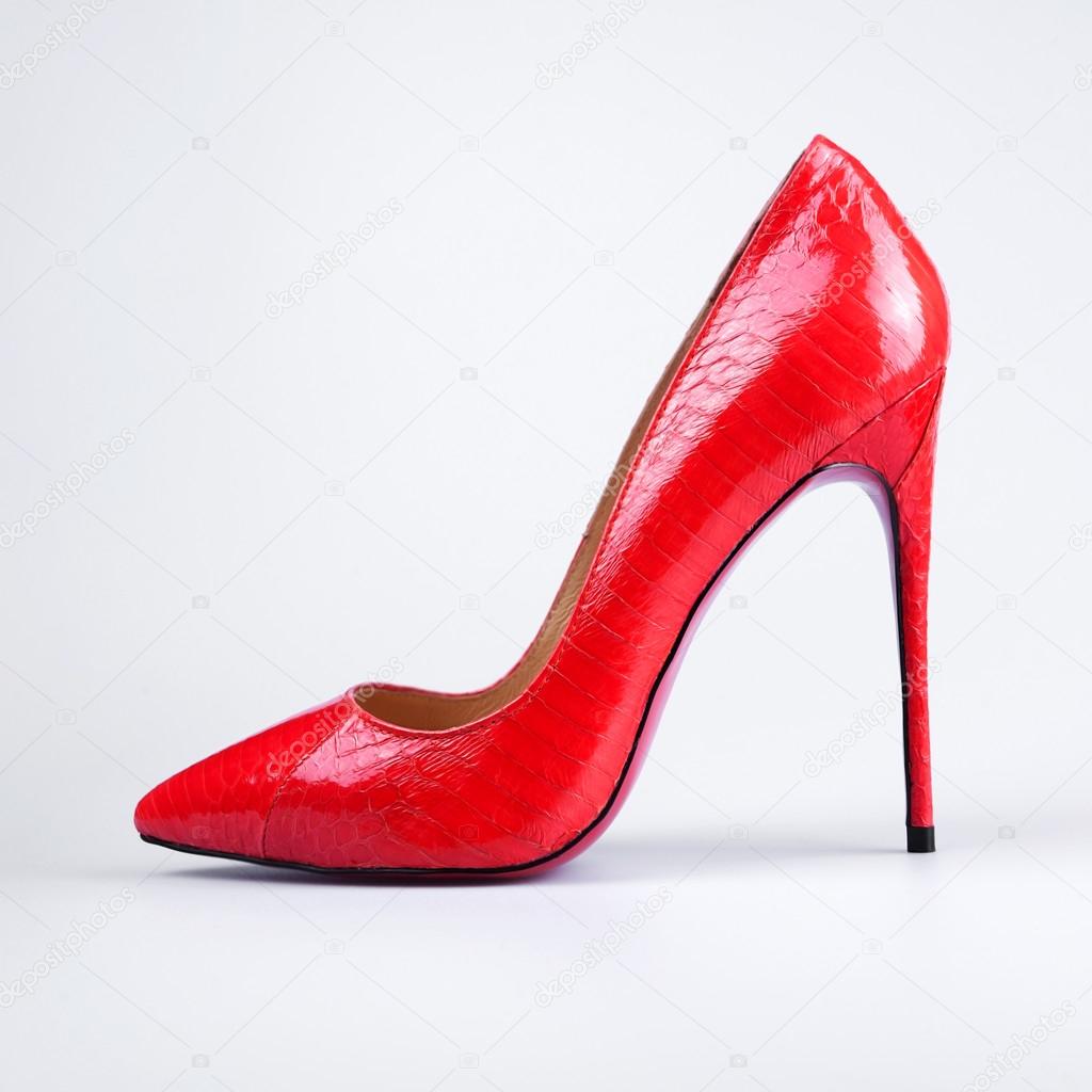 close up of a red high heels on white background
