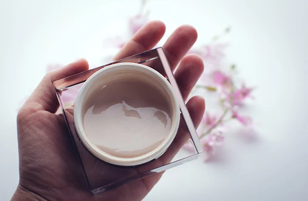 Hand cream and flowers — Stock Image Hand cream and flowers Stock Image
