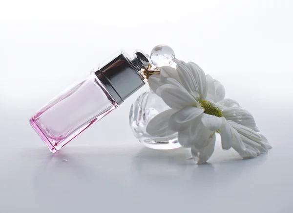 Small bottles of perfume on a white background — Stock Photo, Image