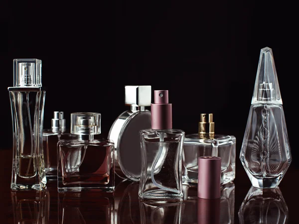 Set of perfumes over dark — Stock Photo, Image