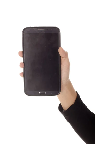 İzole kadın el ile a siyah perde siyah bir telefon tutarak