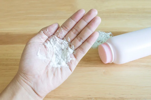 Baby talcum powder on hand — Stock Photo, Image