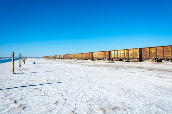 Train on the lake Baskunchak. — Stock Photo, Image