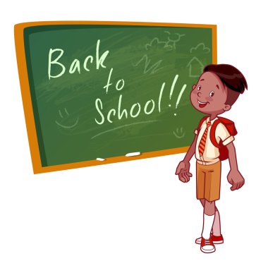 Cute schoolboy in uniform stands near the school board.