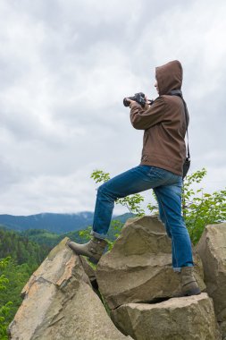 Photographer is shooting in the Carpathian Mountains 