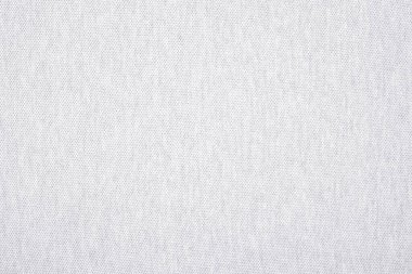 Temiz, beyaz bir dokuma ürününün yüksek çözünürlüklü yakın çekimi. Bu yumuşak, nötr kumaş yüzeyi minimalist arka planlar, moda sunumları ve iç tasarım modelleri için mükemmeldir..