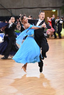 Ballroom dance couple dancing at the competition clipart
