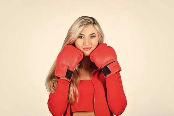 Sport girl. Fitness trainer. Facial skin. Skin care. Elastic skin. Use collagen for firmness. Face massage. Beauty salon. Cosmetology beauty procedure. Wrinkles treatment. Woman boxing gloves