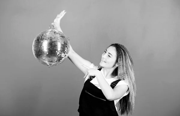 ready for having fun. happy birthday party. disco dancing. celebrating the holiday. girl with disco ball. party goer. lets dance. night life concept. christmas or new year holiday. Party time