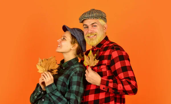 Carefree time together. retro couple autumn leaves. man and woman hold maple leaf. farmer countryside collect fallen leaves. fall seasonal concept. Autumn harvest with Farmers. Happy Thanksgiving day