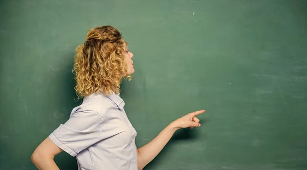 Just look here. Pay attention. Teachers enlighten path of success. Woman teacher in front of chalkboard. Important information to remember. Teacher friend of learners. Teacher explain hard topic