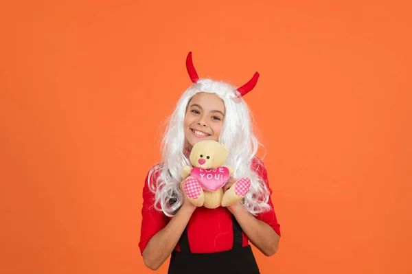 Happy child wear devil horns holding teddy bear toy halloween gift, happy halloween shopping — Stock Photo, Image