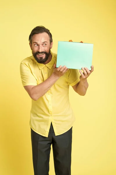 Put your purchase in gift bag. Fashion buyer hold shopping bag. Happy man with paperbag. Purchase bought on sale. Packaging purchase. Black Friday. Cyber Monday. Purchase order, copy space — Stock Photo, Image