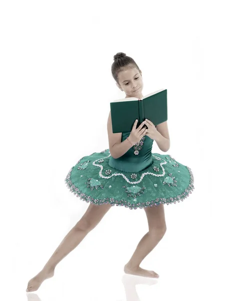 Depriving children ballerina. Most of time child dancer spend in gym training and practicing performance. No time for school studying. Girl ballerina dancing while read book. Ballet career issues — Stock Photo, Image