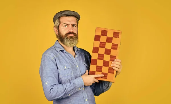 Game strategy concept. Chess lesson. Exercise for brain. Teacher chess competition. Board game. Man playing chess. Chess figures. Intellectual games. Intelligent bearded hipster. Cognitive skills
