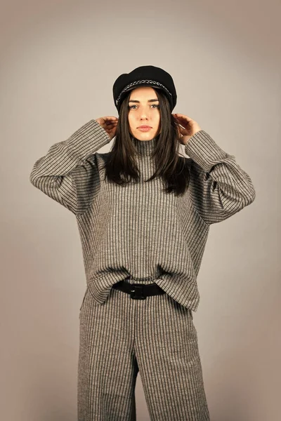 Shop Your Style. Designed for your comfort. Warm comfortable clothes. Casual style for every day. Fashionable knitwear. Knitwear concept. Feel comfortable. Woman wear grey suit blouse and pants