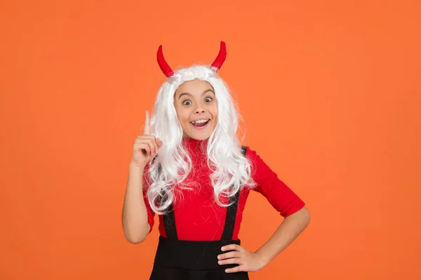 Inspired teenage child in imp horns. cheerful kid has an idea. feel the inspiration. carnival costume party. trick or treat. celebrate the holidays. childhood. happy halloween devil girl — Stock Photo, Image