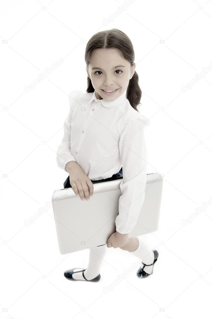 Modern technic education includes using laptop. Girl cute long curly hair isolated white background. Child girl school uniform clothes carries laptop. Child wear school uniform smart kid smiling face