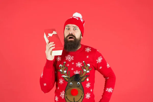 Winter holidays sale. happy new year. merry christmas. surprised bearded man in santa hat and sweater. brutal hipster celebrate xmas party. winter holiday preparations. present and gift shopping sale — Stock Photo, Image
