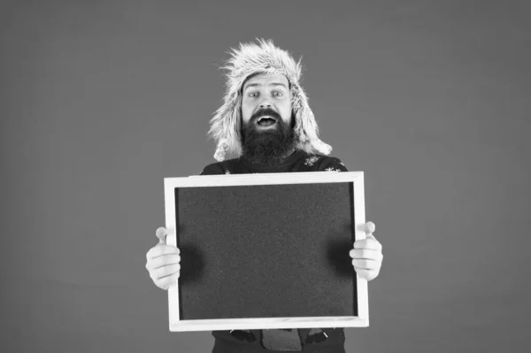 Promotion. Seasonal offer. Presentation concept. Winter announcement. Winter event. Winter holiday. Schedule timing concept. Bearded man blank blackboard copy space. Chalkboard for information — Stock Photo, Image