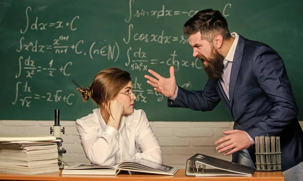 Shouting and waving his hands. Angry teacher or student. Brutal hipster say angry words to pretty woman. Extremely angry. Being angry and furious. Anger. Bearded man in bad temper
