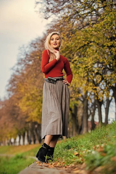 the pleated midi. woman warm autumn skirt outdoor. relax while walking. enjoy casual day. Clothing features pleats. must-have skirt. trendy girl wear corrugated skirt. pleated skirt collection