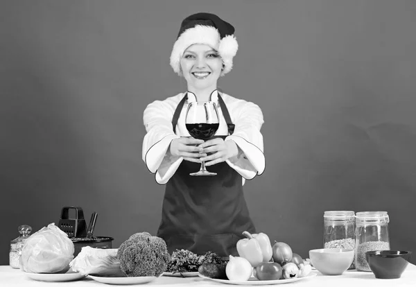 Christmas menu. No stress. Woman chef cooking wear santa hat drink wine. Best christmas recipes. Enjoy easy ideas for holiday parties and holiday dinners. Festive menu concept. Christmas dinner ideas