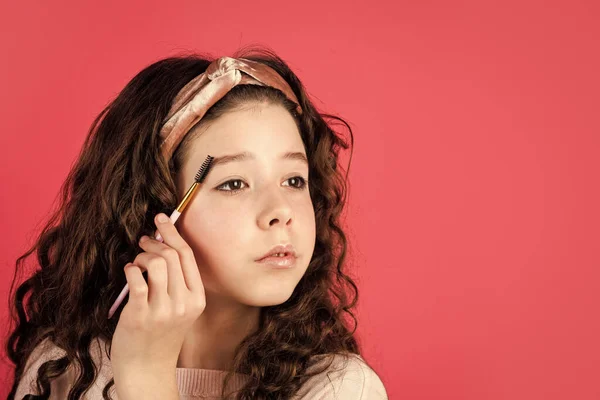 small girl in beauty salon. little girl in retro fashion headscarf. makeup for kid. happy childrens day. small girl with long curly hair. party with cosmetic. relax and having fun. copy space