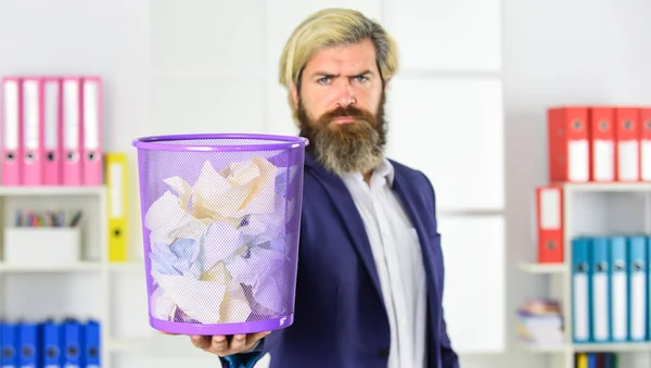 man read piece of paper. office worker digging in garbage bin. businessman hold trashcan. man in office look for lost note in paper bin. crumpled paper in wastepaper basket. selective focus